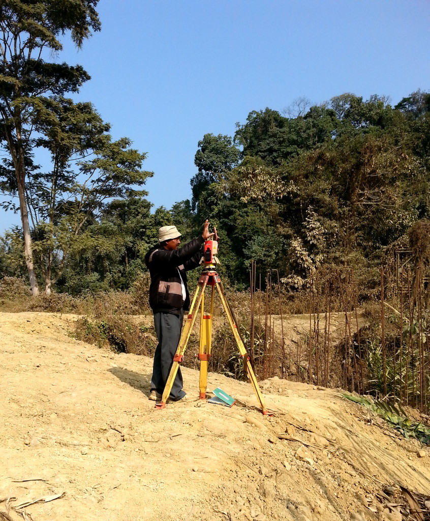 Surveyor siting alignment of road